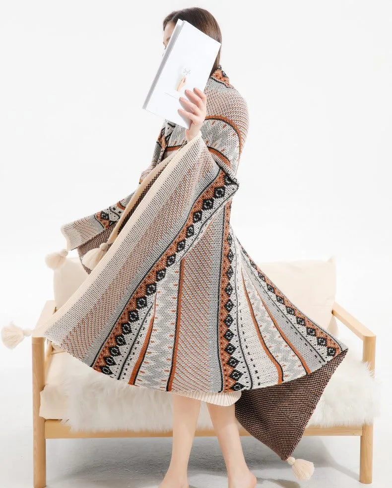 Acrylic sofa blanket with tassels in geometric pattern colour option on a sofa