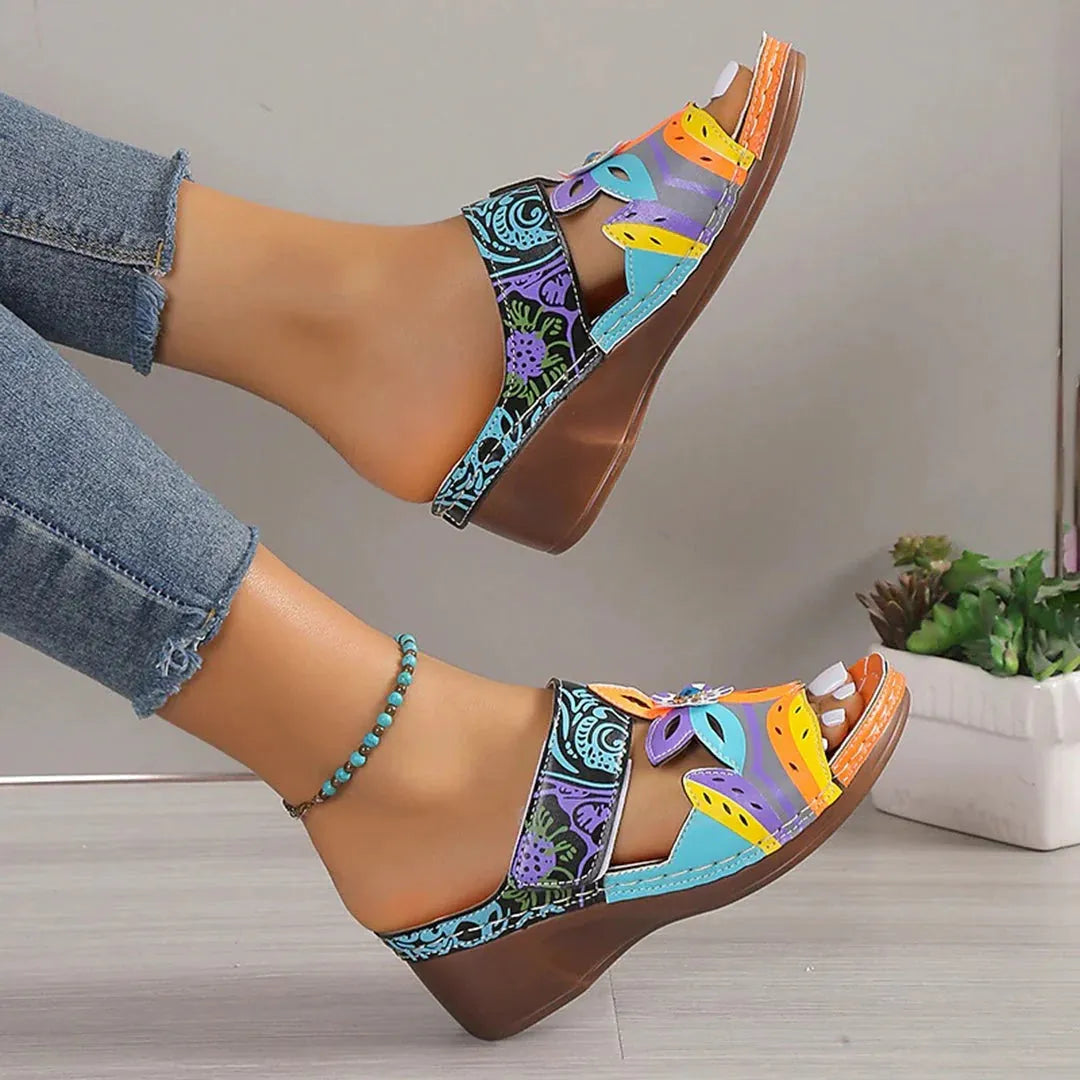 Colourful ethnic pattern women's slip-on sandals with cowhide upper and rubber sole in multiple colour options.