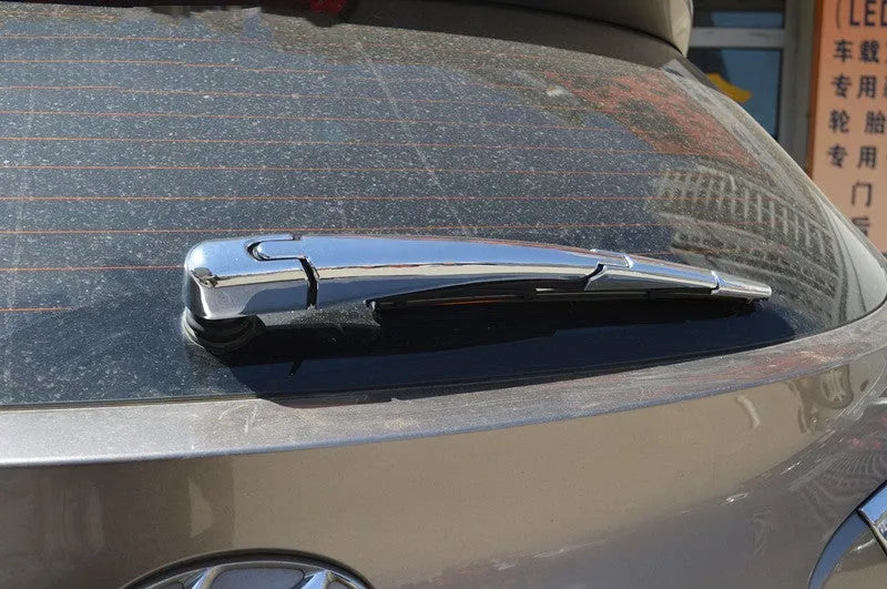 Four silvery ABS plastic rear window wiper cover trims for 2010 Hyundai models.