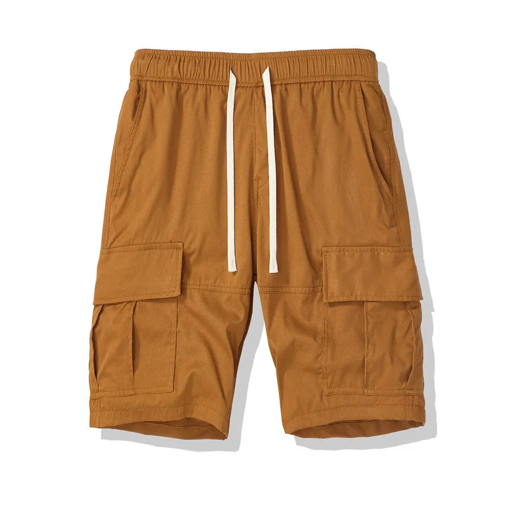 Man wearing loose-fit black cropped trousers with multiple pockets, summer casual style