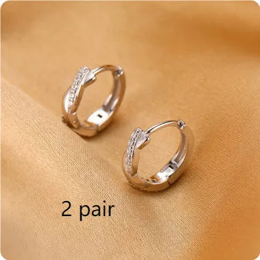 Geometric hemp rope earclip earrings in gold or silver copper with diamond treatment and round elements