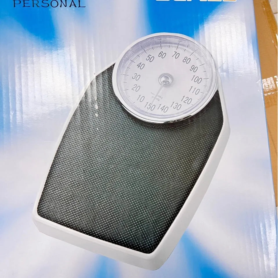 Black mechanical pointer body weight scale with large dial display measuring 47x35x11cm