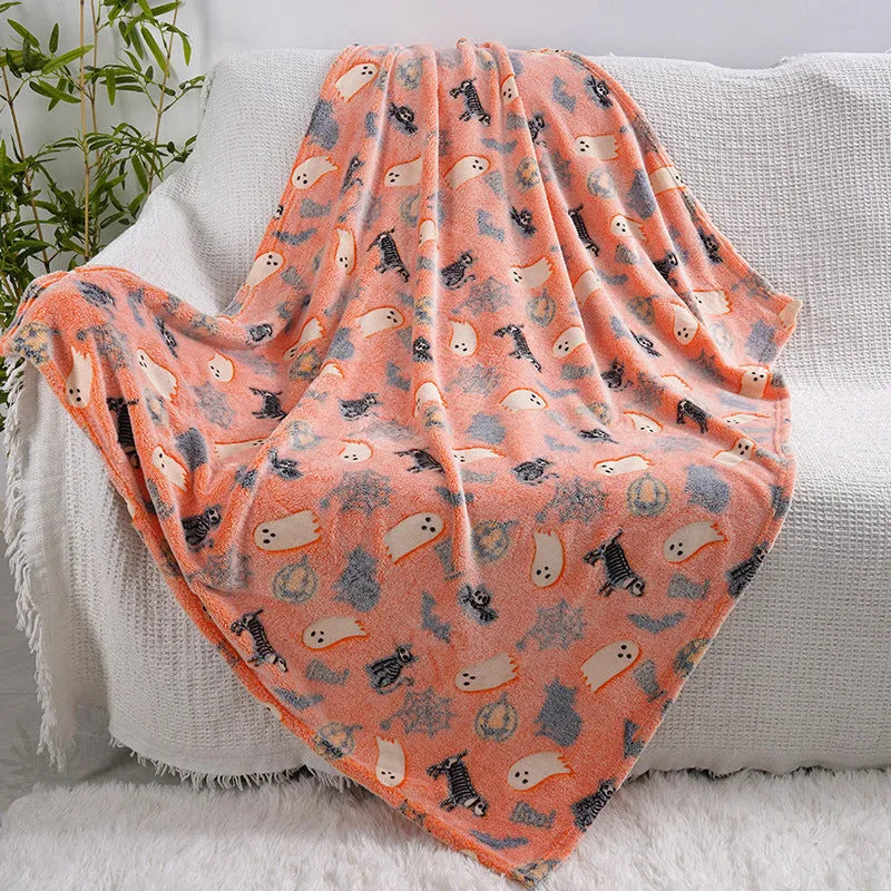 Children's cartoon flannel blanket in colourful design on bed