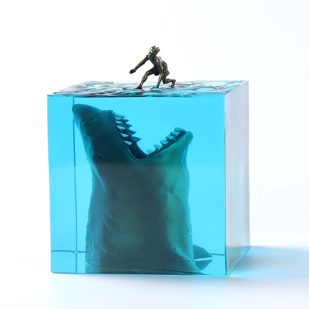 Epoxy resin shark surfer night light ornament with crystal glue details on blue background