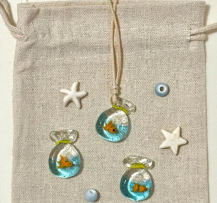 Women's necklace with coloured glaze pendant on a cotton and linen clavicle chain.