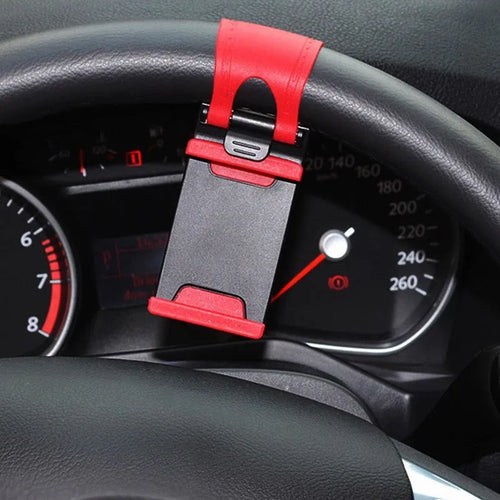 Black steering wheel clip mount holding smartphone for hands-free car use