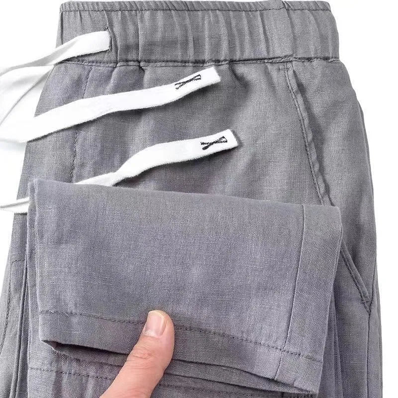 Pure linen Chinese-style straight leg trousers with a drawstring waist in apricot colour.