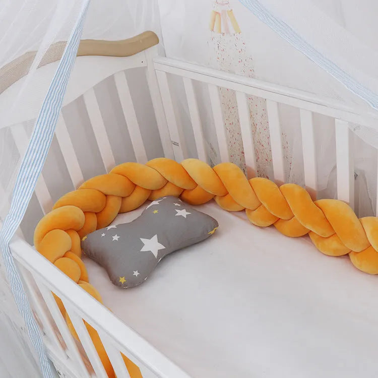 Braided knot crib bumper in spandex velvet, showing flexible length options for cot protection.