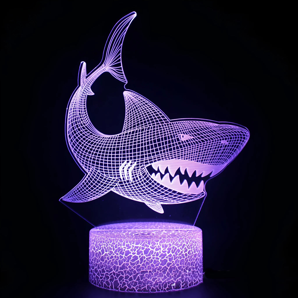 Shark series 3D acrylic LED table lamp with remote control on a desk.