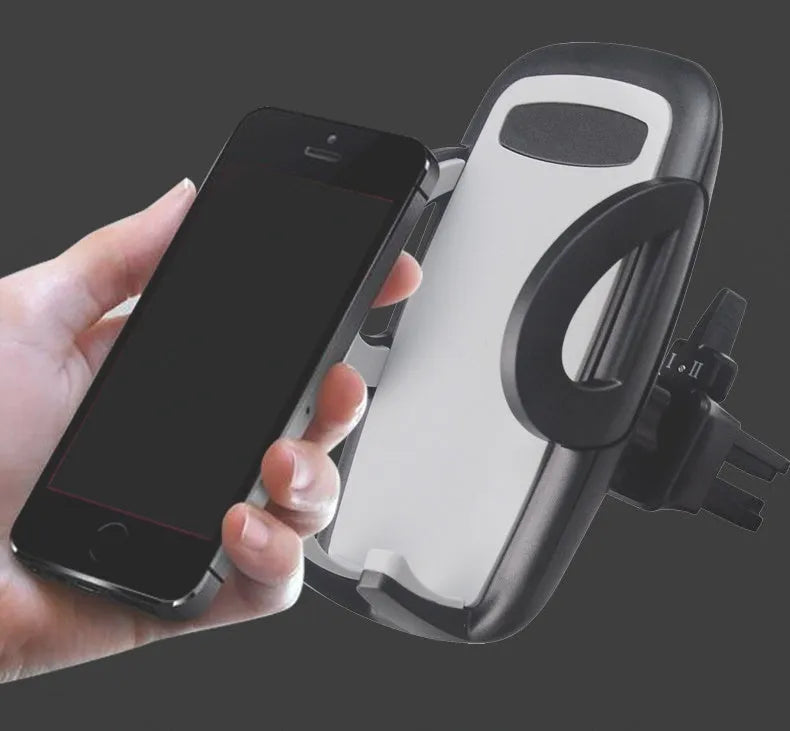 Black plastic car vent phone holder mounted on air conditioning outlet with smartphone