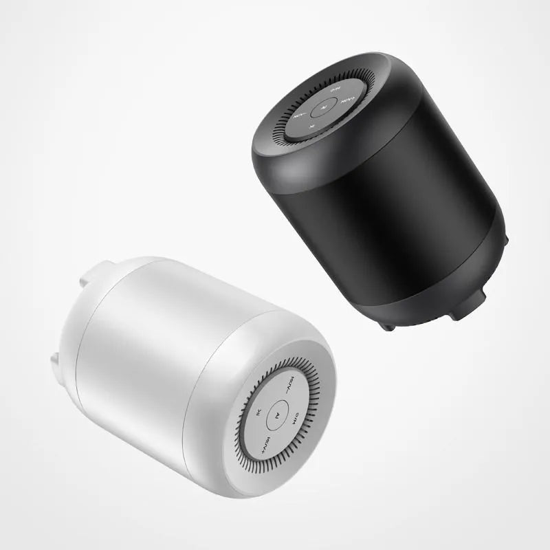 Black and white Bluetooth speaker with AI voice control showing button interface