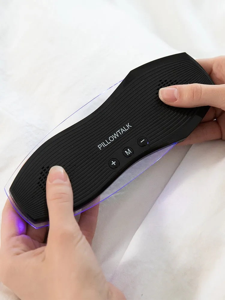 Black true wireless earbuds and their USB charging case, designed for sleep.