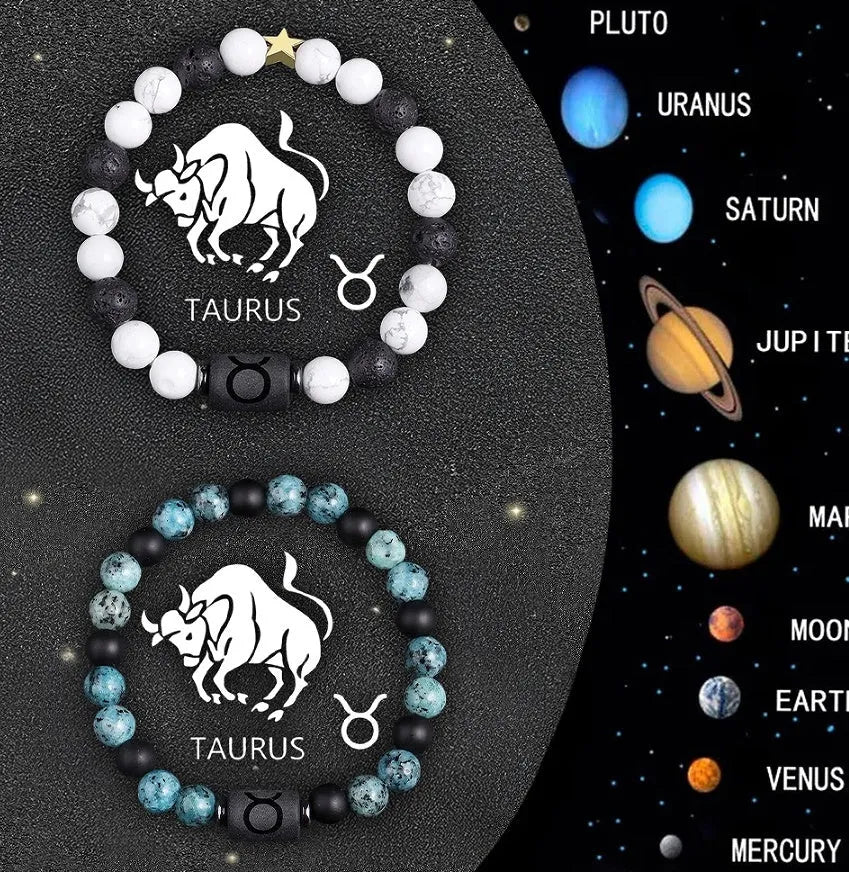 Two natural stone beaded zodiac bracelets with adjustable strings on wooden surface