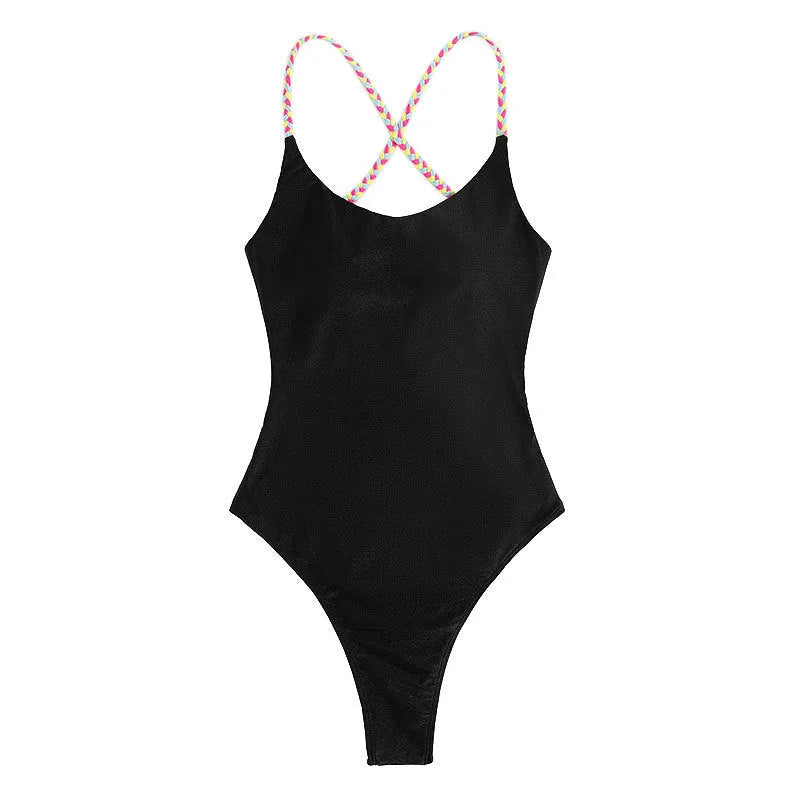 Black women's one-piece swimsuit with a backless and sleeveless design on a mannequin.