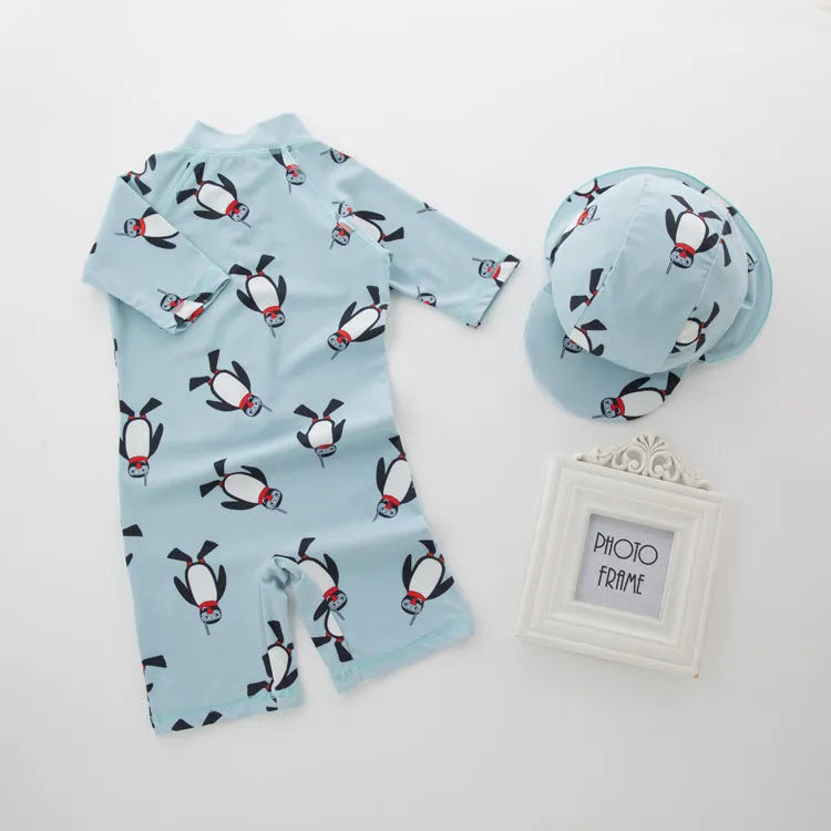 Boy's penguin print swim set with long sleeves and matching swimming cap for ages 2-7 years