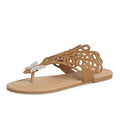 Women's black slip-on sandals with rhinestone decoration and flip-toe design.