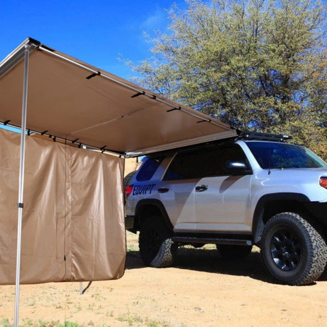Camouflage car sunshade tent with aluminium poles set up outdoors, showing two-room interior.