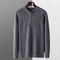 Man wearing a beige pure wool loose fit sweater with a diamond lattice pattern and a half-zip neck.