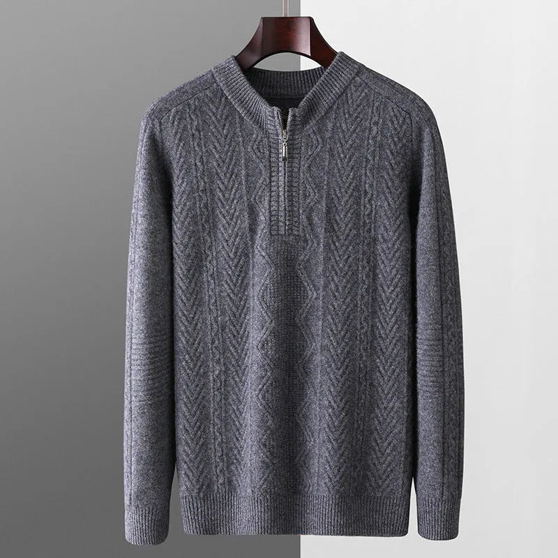 Man wearing a beige pure wool loose fit sweater with a diamond lattice pattern and a half-zip neck.