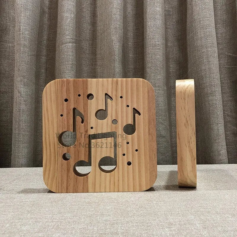 Square pine wood USB-powered LED lamp emitting warm white light on a desk.