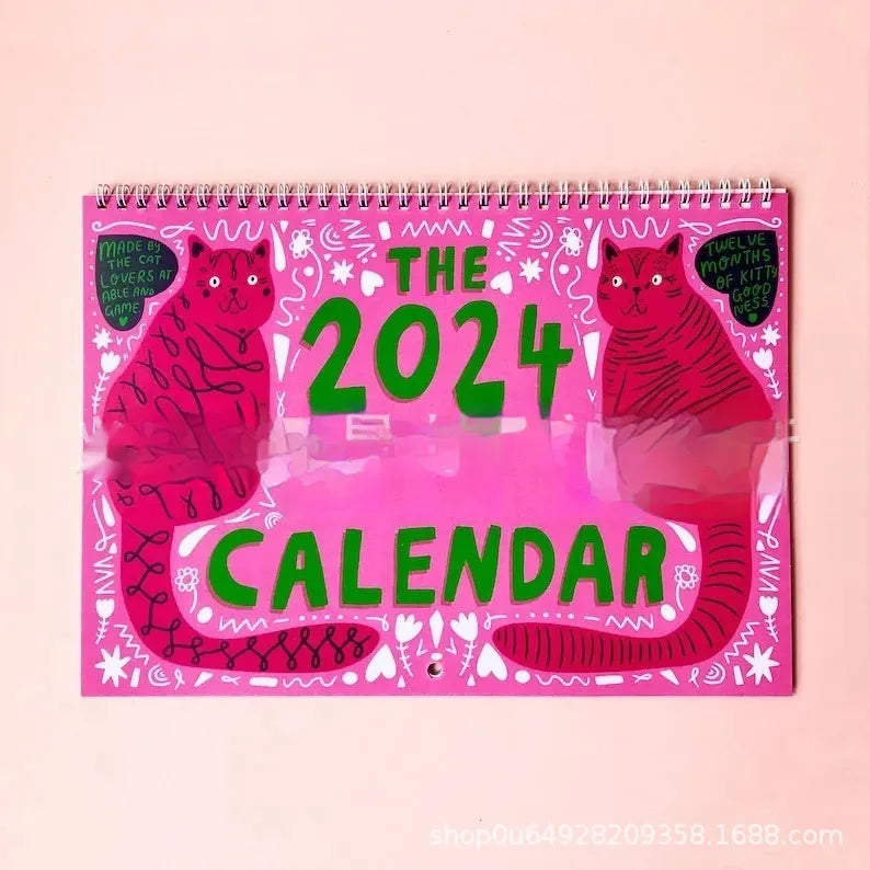 Cat Calendar Wall Planner for 2024 or 2025 with seasonal designs on paper.