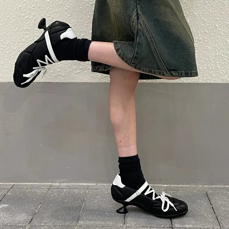 Women's silver lace-up bow sports shoes with a low-top and round toe on a white background.