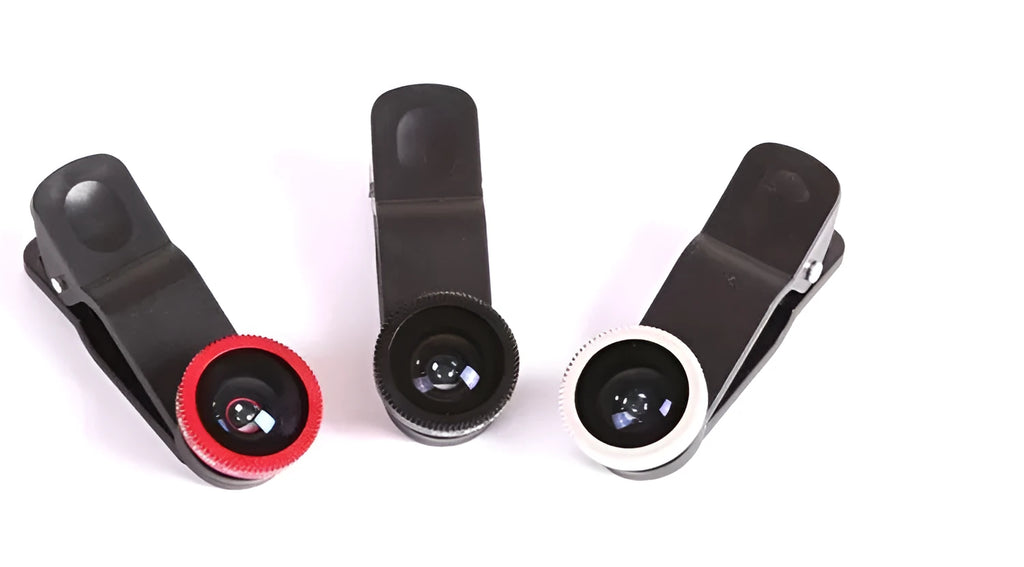 Mobile phone with a mini clip-on camera lens attached, alongside macro, fisheye, and wide-angle lenses in a case.