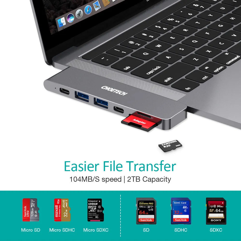 Silver aluminium USB-C multi-port adapter hub with SD card slot, HDMI, USB ports, and Power Delivery.