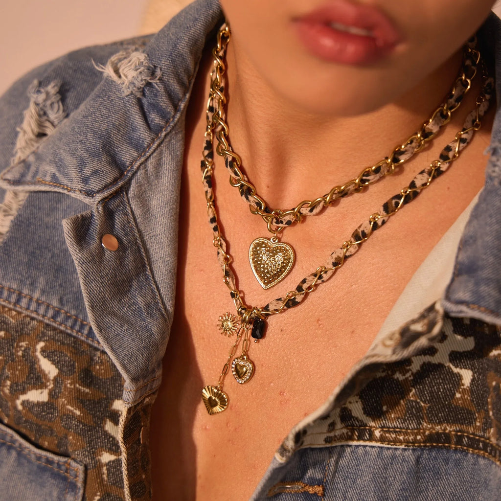 Gold-coloured stainless steel necklace with an adjustable chain and a choice of Big Heart or geometric Love Sun pendant.