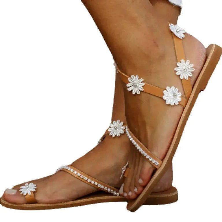 Brown ladies flat sandals with flower decorations and herringbone toe pattern