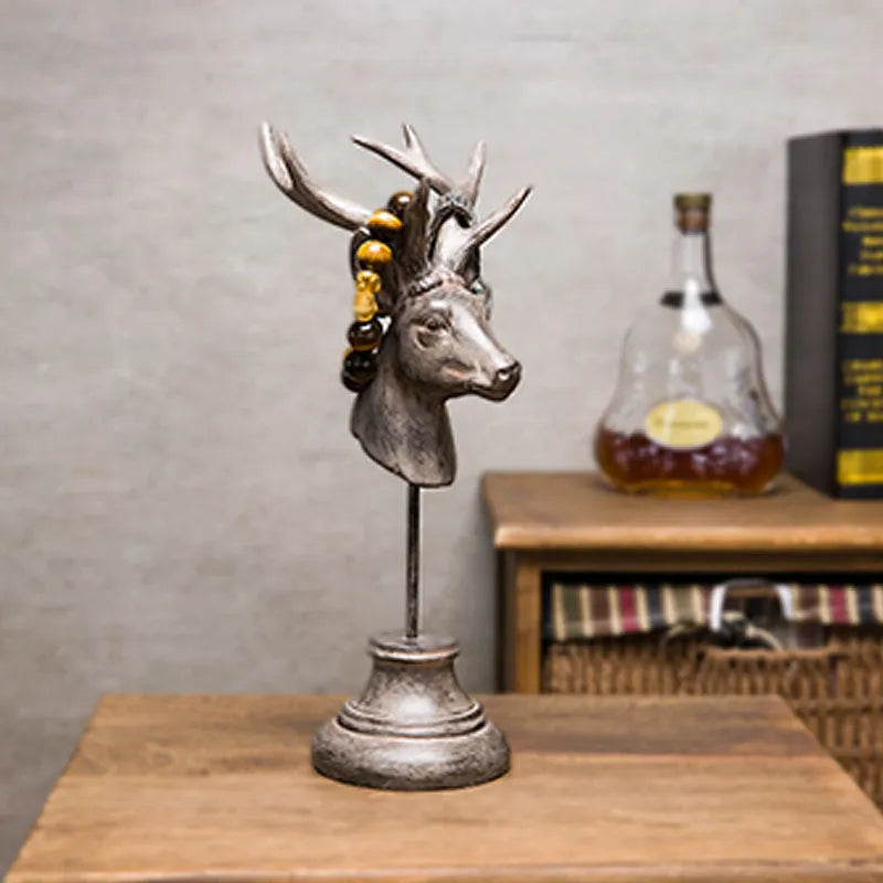 Tall black natural resin animal sculpture decoration on a wooden shelf.