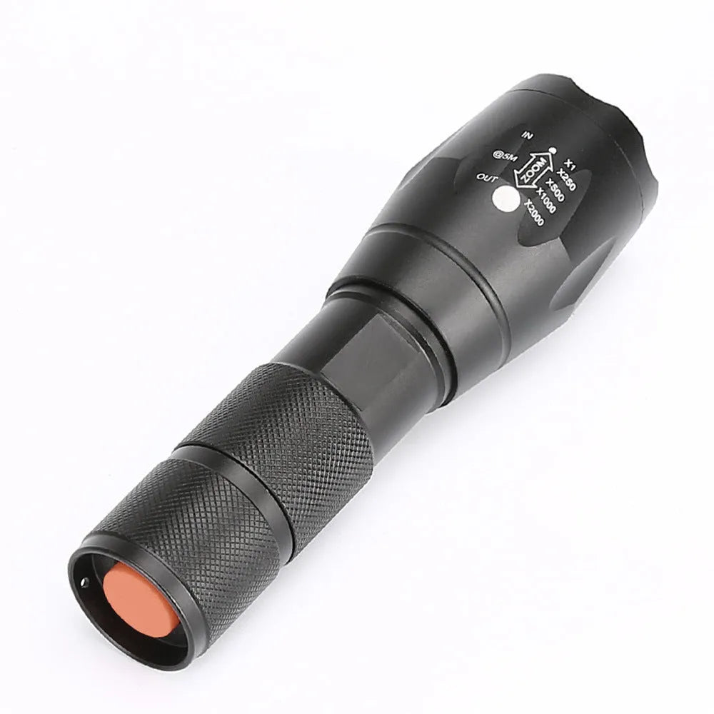 Black aluminium alloy zoomable LED flashlight with adjustable focus head for outdoor use.