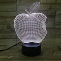 3D fruit-shaped colourful night light with touch controls and acrylic shade on a surface.