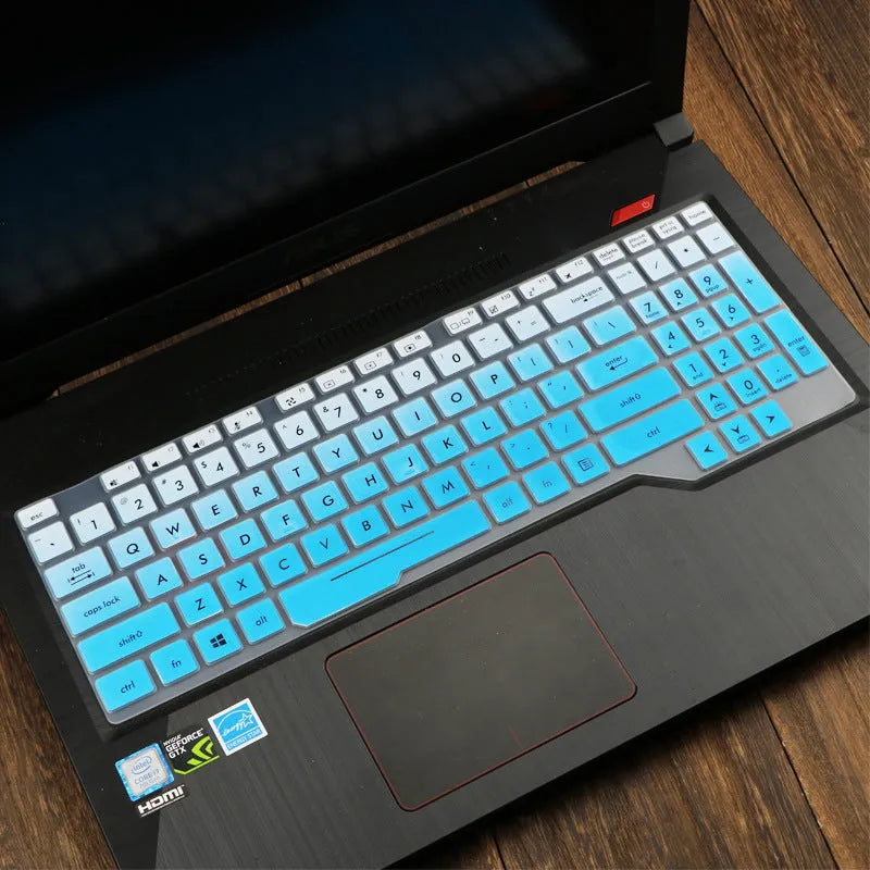 Clear protective keyboard film cover for ASUS Flight 14-inch laptop on a keyboard.