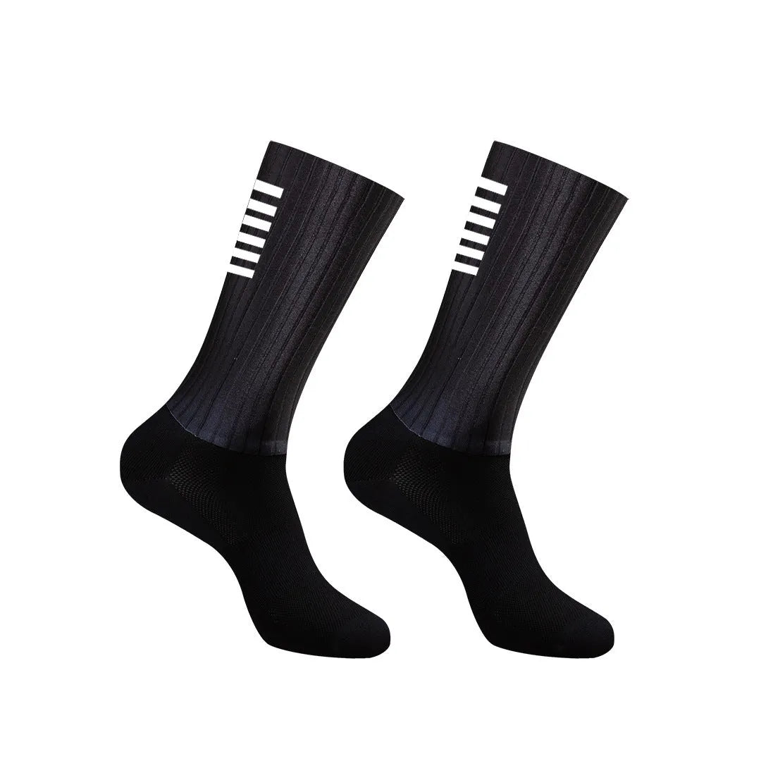 Pair of breathable chemical fibre blend athletic socks for cycling and running, shown in orange colour.
