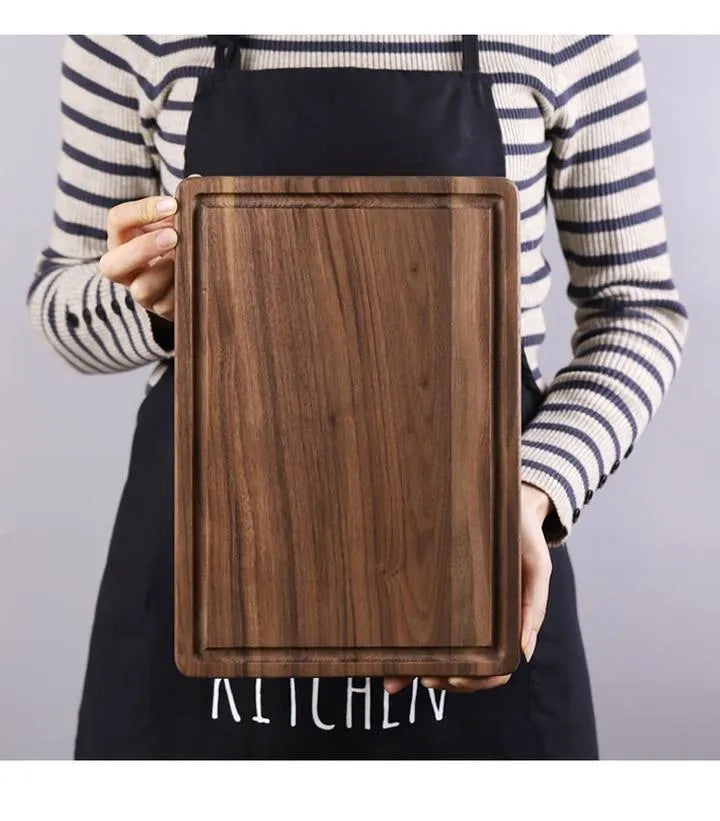 Black walnut wood cutting board with juice groove and side handle shown in three size options