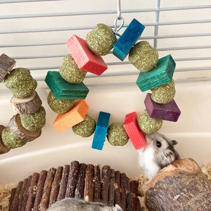 Decorative straw ball ring chew toy made from applewood for hamsters and small pets.