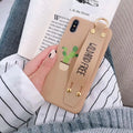 Green wristband holder phone case with graffiti design for iPhone, showing the integrated carrying loop.