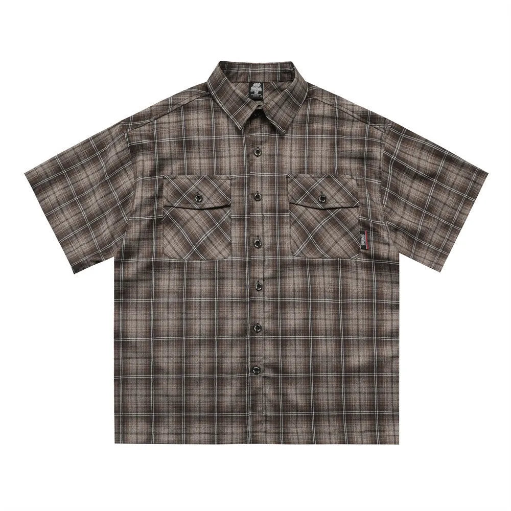 Men's black and brown plaid short sleeve shirt with embroidered letter design and lapel collar.