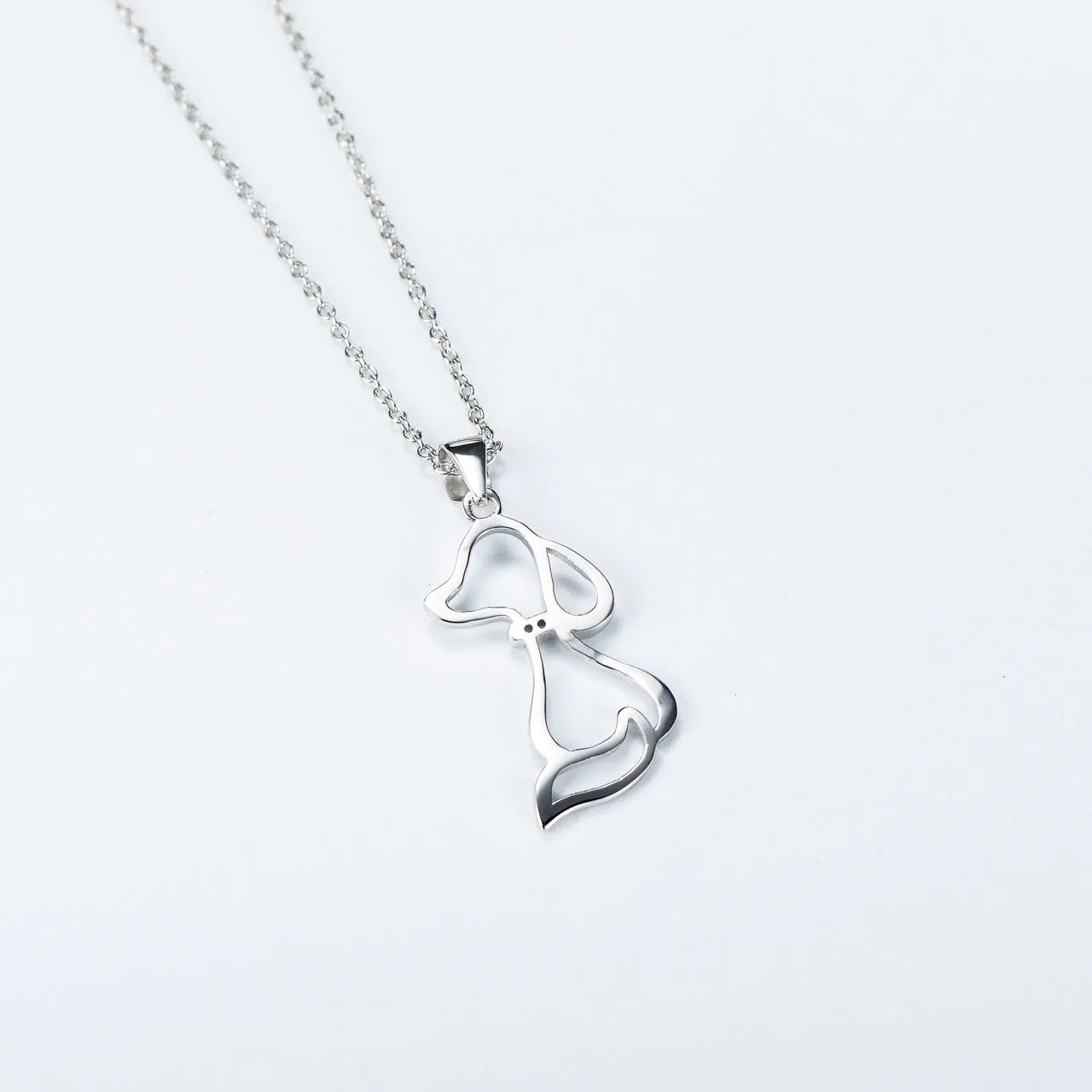 925 sterling silver dog pendant necklace with round bead chain on display