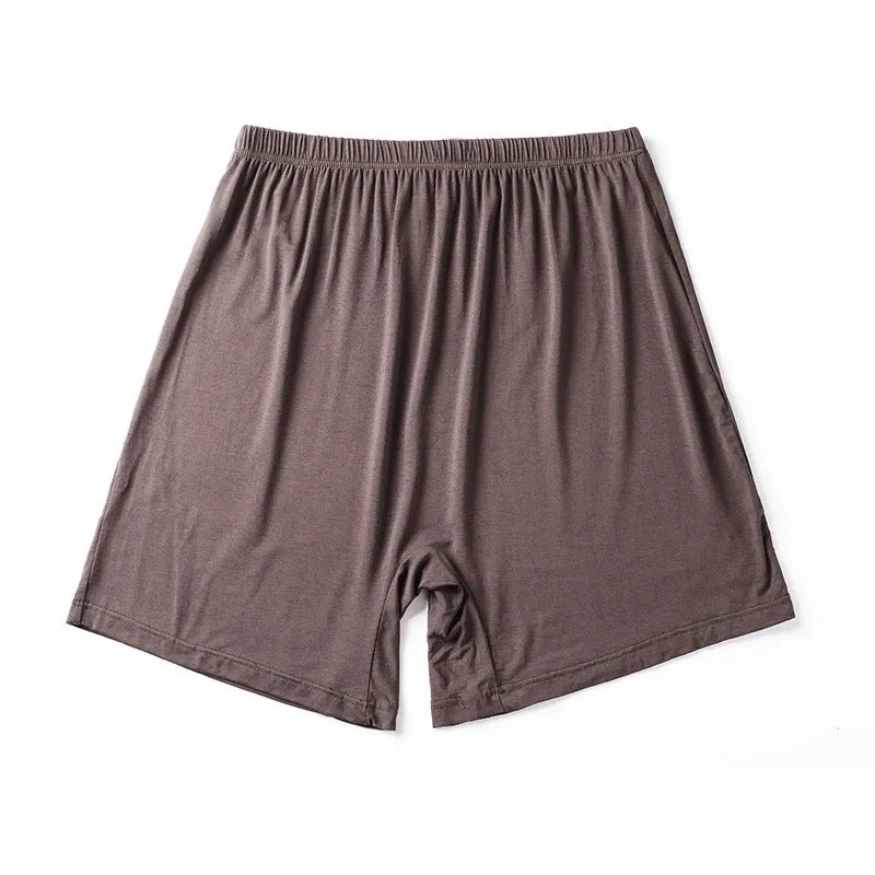 Mannequin wearing solid black high waist modal boxer shorts for men