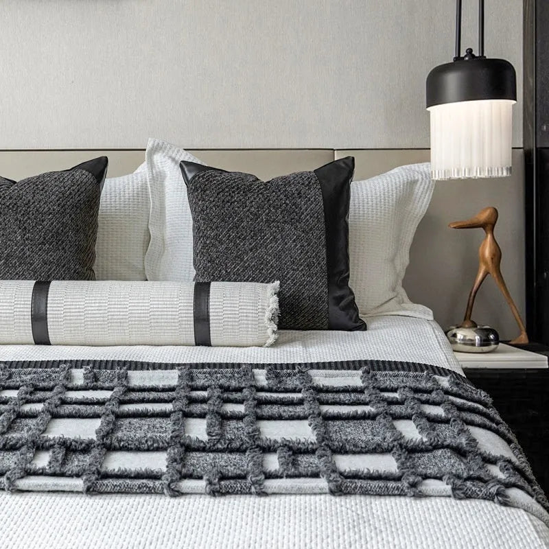 Polyester bed runner and nap blanket set with plaid pattern on bed with matching pillowcase and round pillow