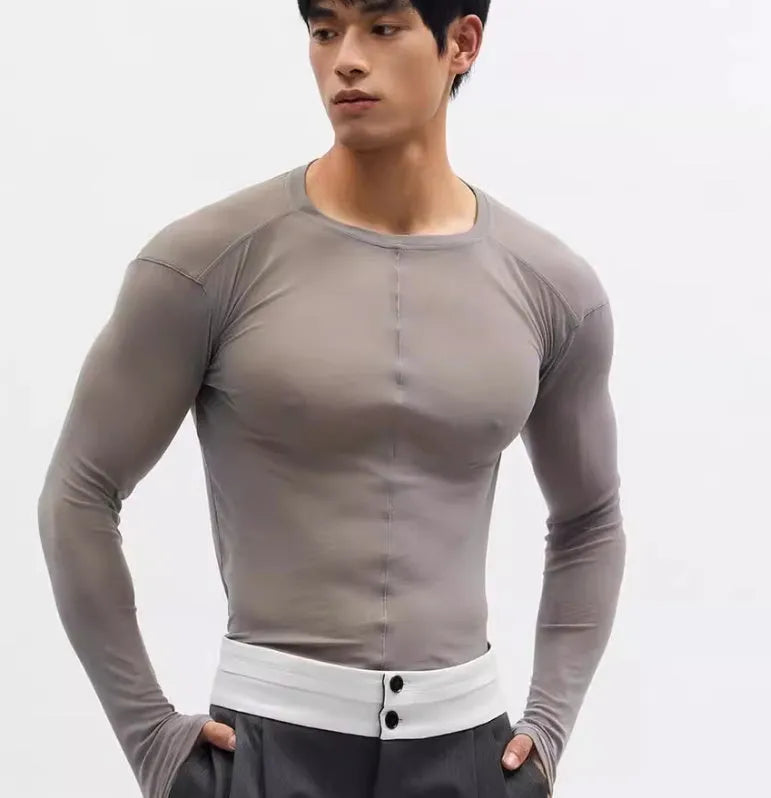 Black women's slim-fit pullover with mesh see-through texture and long sleeves.