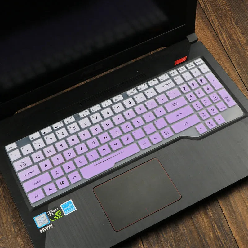 Clear protective keyboard film cover for ASUS Flight 14-inch laptop on a keyboard.