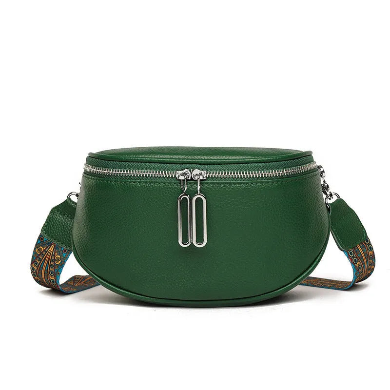 Women's soft PU leather messenger bag in saddle shape with cross-body strap, shown in green colour.