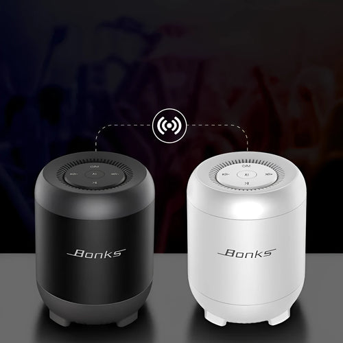 Black and white Bluetooth speaker with AI voice control showing button interface