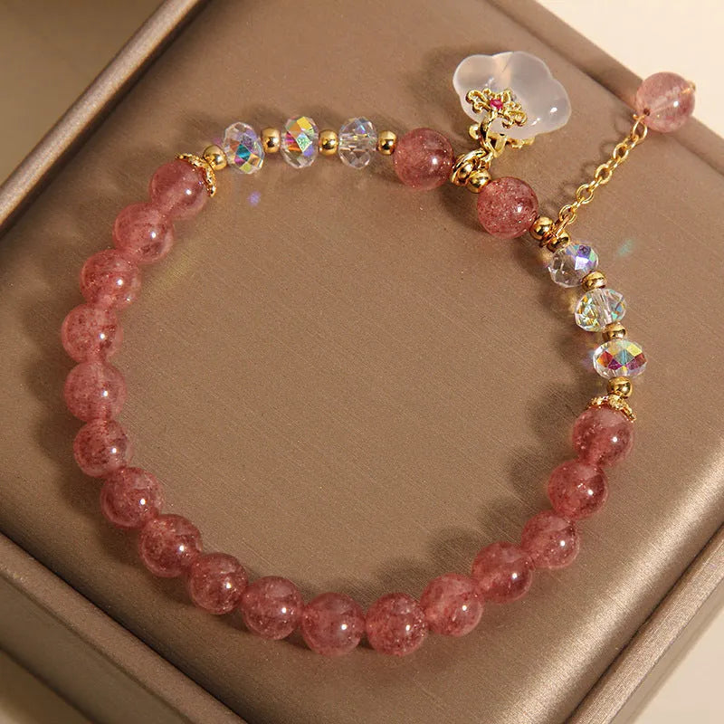 Women's adjustable crystal bracelet with strawberry quartz and white agate beads showing adjustable chain detail