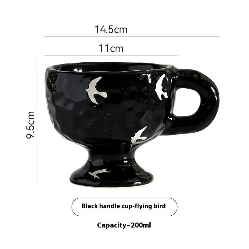 Hand-pinched irregular shaped ceramic mug in solid colour with modern simplicity design