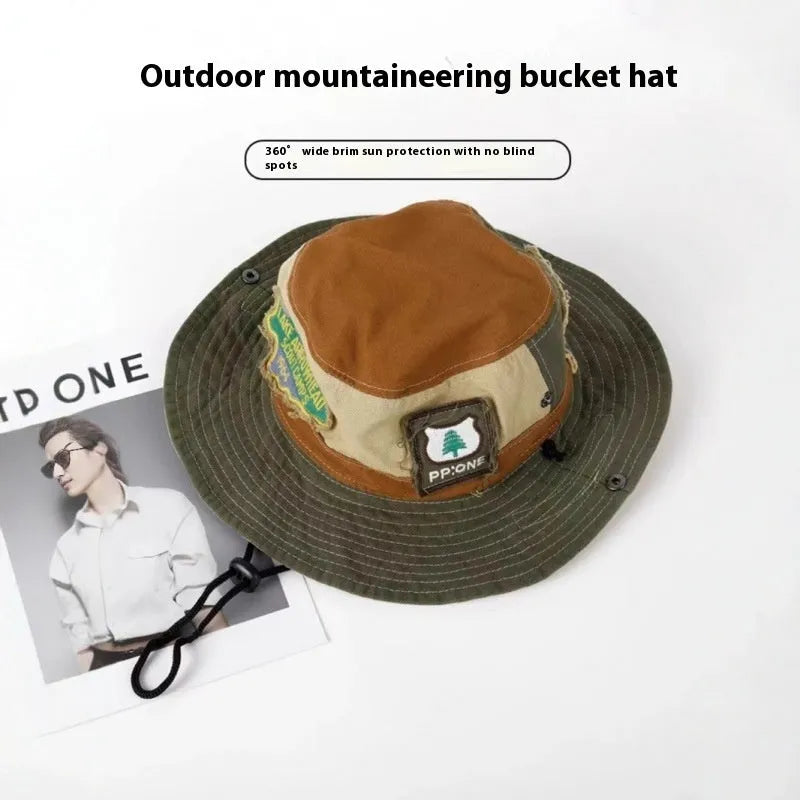 Army green cotton fisherman hat with flat top crown and patchwork detailing