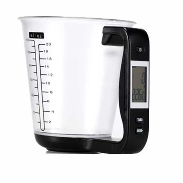 Green electronic kitchen scale measuring cup with digital LCD display on handle.